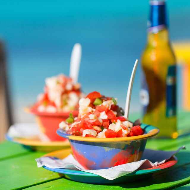 Island food in the Bahamas Conch Salad and Kalik Beer